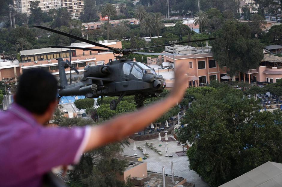 AH-64+AD+military+attack+helicopter+flies+over+a+street+near+presidential+palace%252C+in+Cairo%252C+Egypt+%25283%2529.jpg