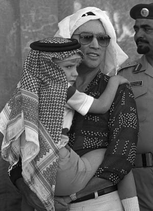 trudeau-holding-sacha-saudi-head-dress.jpg