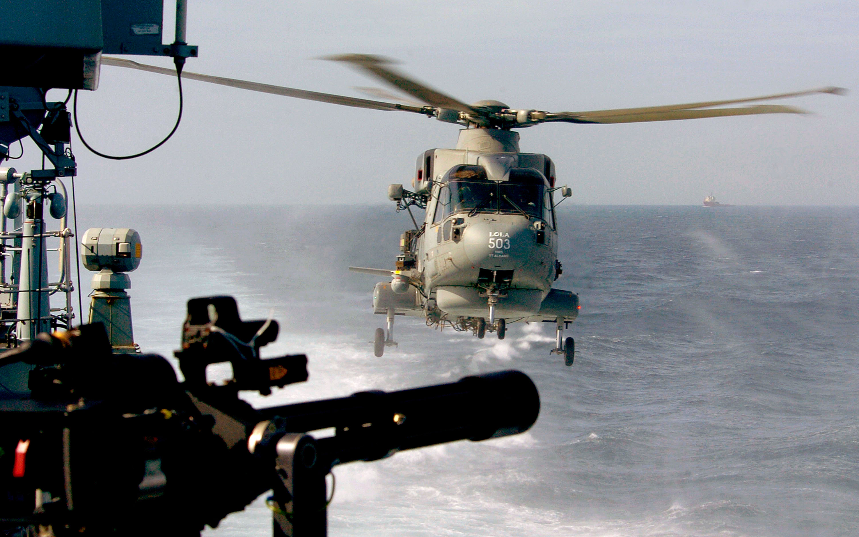 HMS_St_Albans'_Merlin_Helicopter_Returns_to_the_Ship_Near_Gibraltar_MOD_45151070.jpg