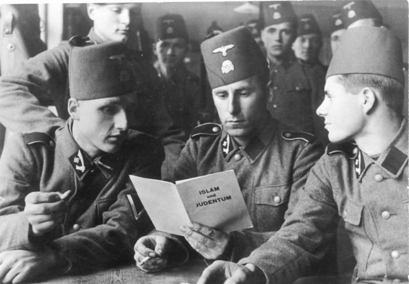 Soldiers-of-the-13th-SS-Division-with-a-brochure-Islam-and-Judaism-1943..jpg