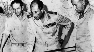 Egypt's Chief-of-Staff Saad el-Shazly (left), President Anwar Sadat  (center) and Minister of War Ismail Ali review battlefield developments in 1973.