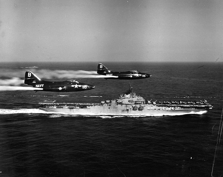 F9F-2_Panthers_of_VF-191_fly_past_USS_Princeton_%28CV-37%29_off_Korea%2C_circa_in_May_1951_%28NH_97047%29.jpg