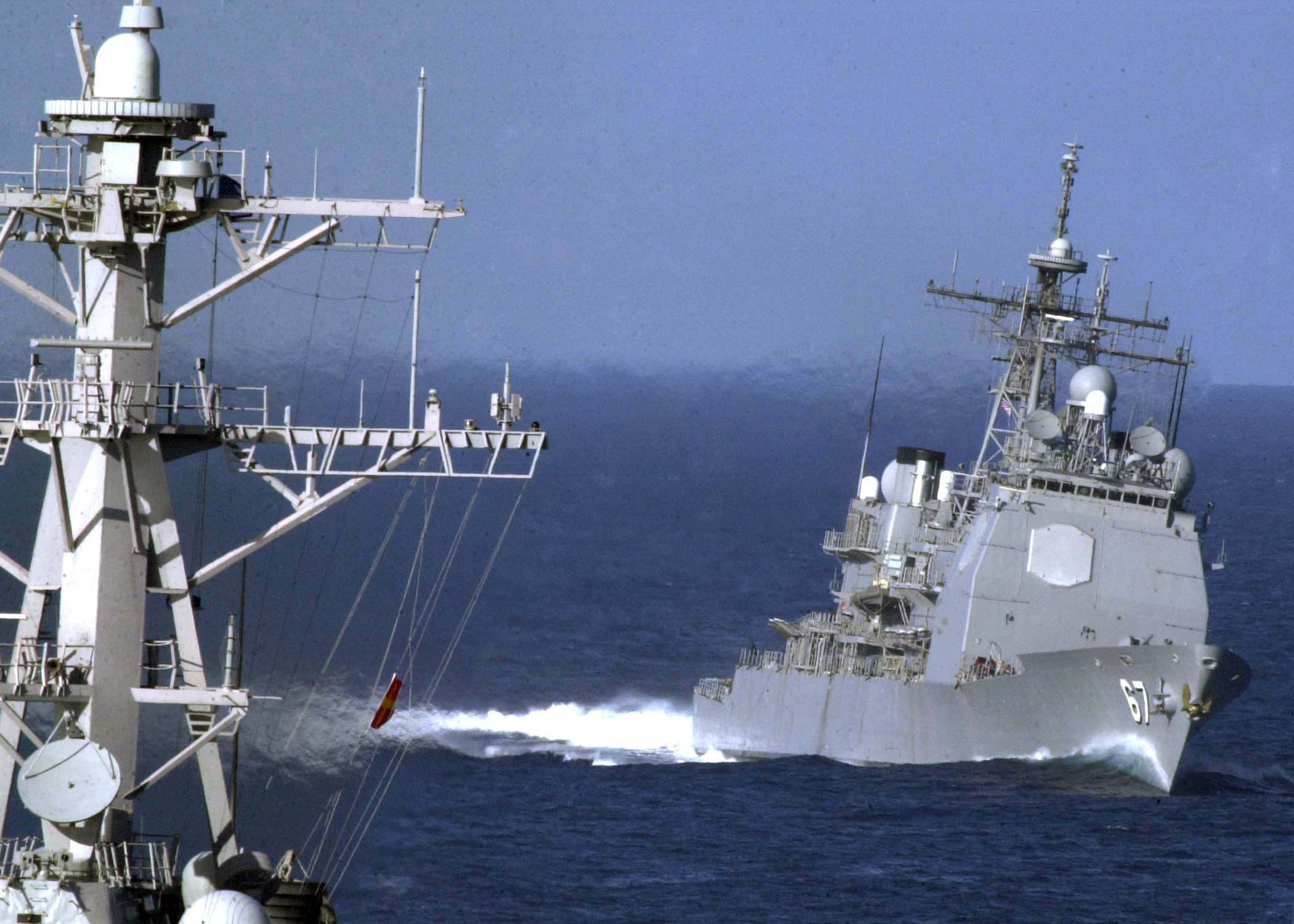 US_Navy_041110-N-9079D-012_The_Ticonderoga-class_guided_missile_cruiser_USS_Shiloh_(CG_67)_approaches_the_guided_missile_destroyer_USS_Shoup_(DDG_86)_while_preparing_for_a_replenishment_at_sea_(RAS)_with_the_aircraft_carrier_US.jpg