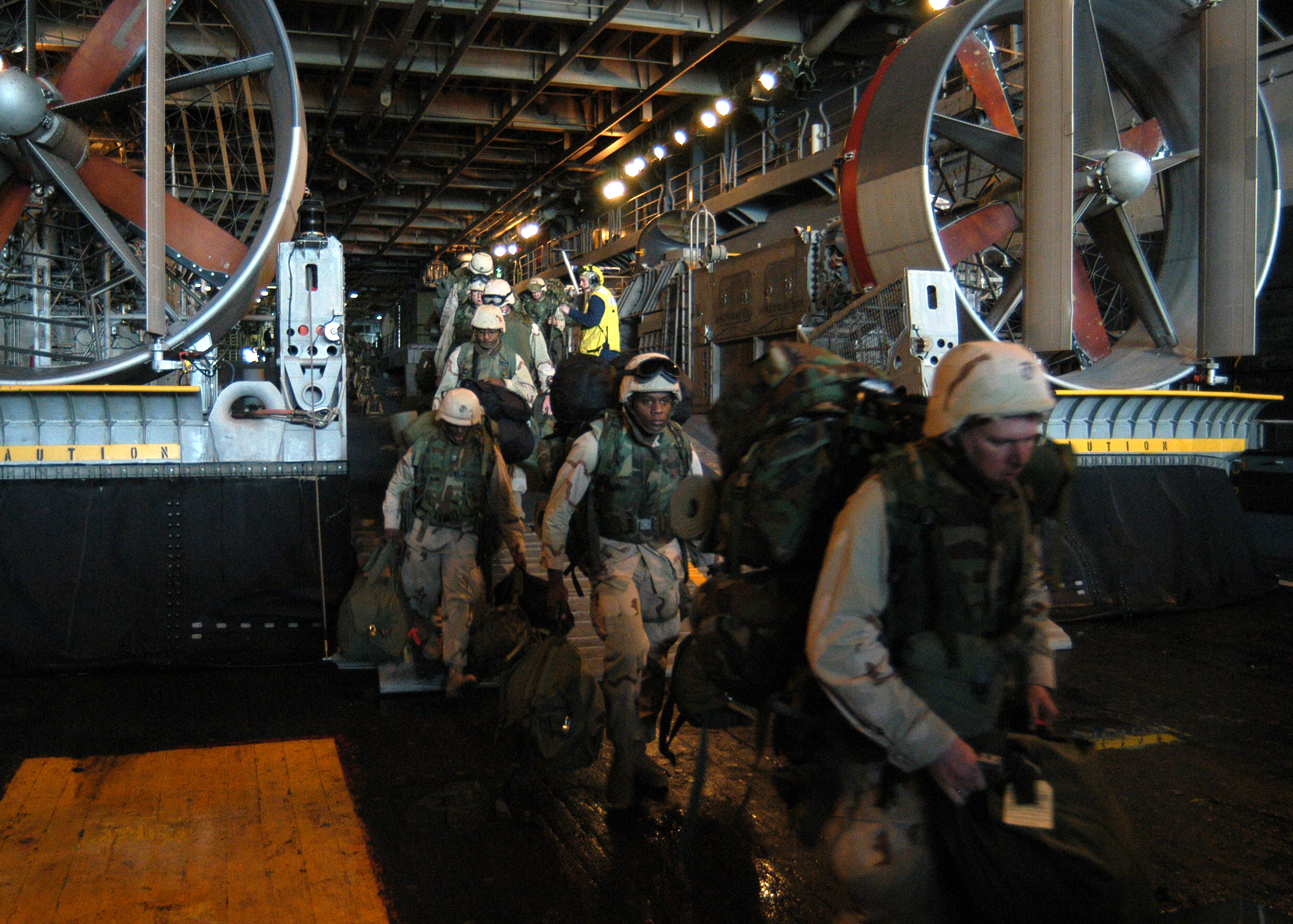 US_Navy_030217-N-2972R-007_In_the_well_deck_aboard_the_amphibious_assault_ship_USS_Kearsarge_(LHD_3),_Marines_assigned_to_the_2d_Marine_Expeditionary_Brigade_(2d_MEB)_embark_Assault_Craft_Unit_4_(ACU-4)_Hopper_68.jpg
