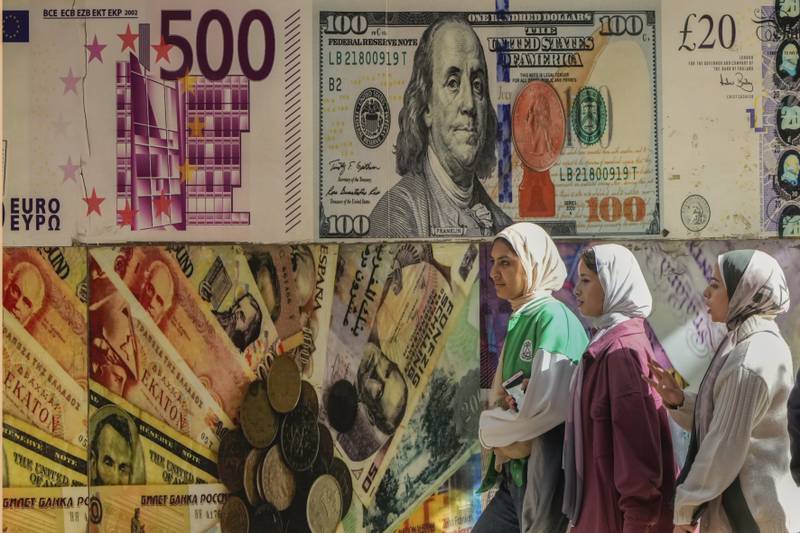 تواصل مصر محاربة ارتفاع التضخم وسط تراجع عملتها. AP تواصل مصر محاربة ارتفاع التضخم وسط تراجع عملتها. AP
